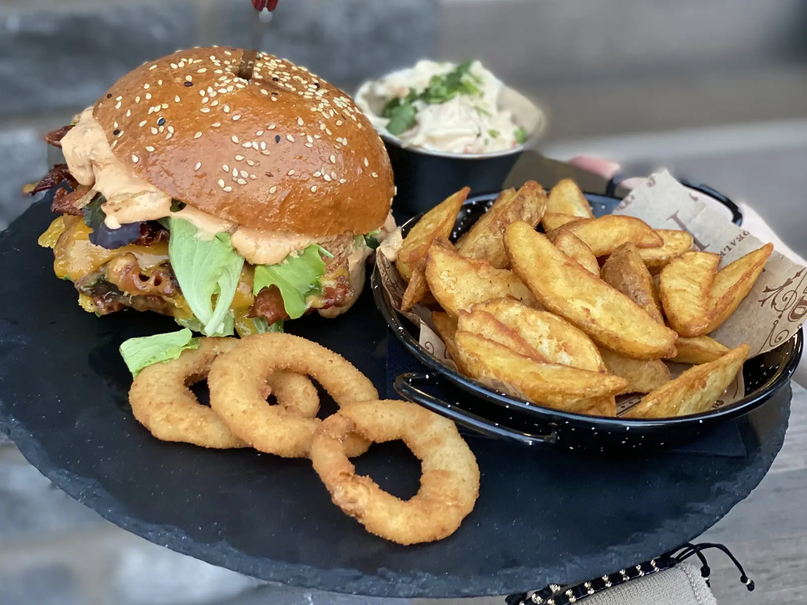 Burger with fries and onion rings